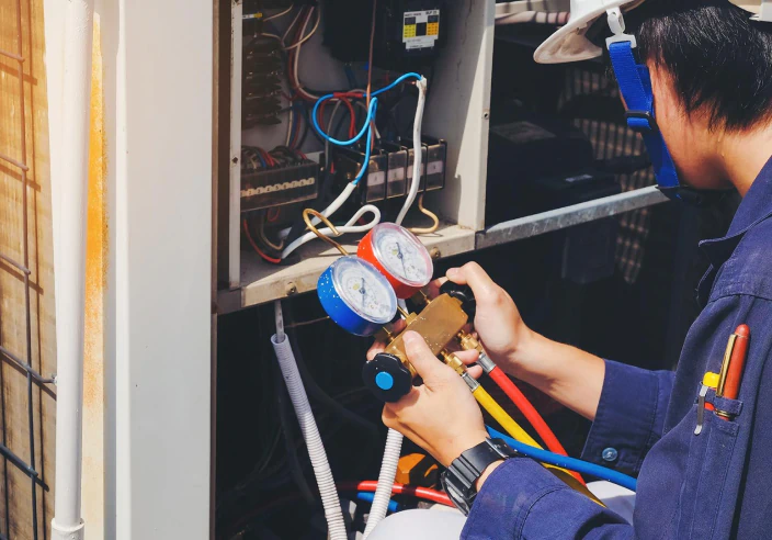 hvac technician repairing hvac unt