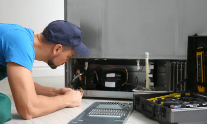 close up shot of worker repairing the commercial refrigerator