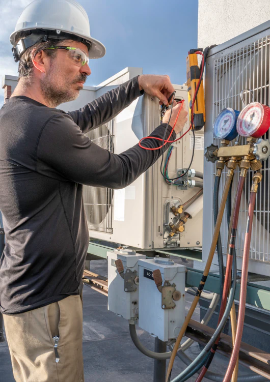 hvac technician inspecting